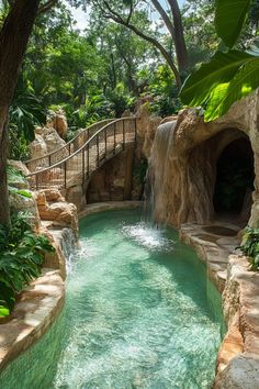 a small waterfall in the middle of a pool surrounded by greenery and stone steps