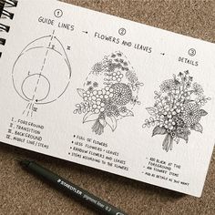 some flowers and leaves are drawn on a piece of paper