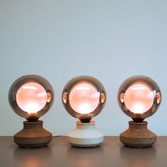 three small lights sitting on top of a table