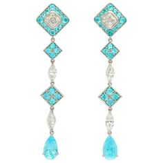 The quintessential shoulder duster earrings, featuring the most sought after tourmalines from Paraiba, Brazil. The matching pear shape Paraibas are mounted with very high quality emerald cut and marquise diamonds as well as smaller round Paraibas. At 2 5/8 inches (6.7cm) long they will never fail to impress. A completely one of a kind design. 2 pear shape Paraiba tourmalines total weight 3.95cts 40 round Paraiba tourmalines total weight 3.06cts 2 emerald cut diamonds 1.01cts each, both GIA certi Shoulder Duster Earrings, Duster Earrings, Brilliant Cut Diamond Ring, Rings Luxury, Tourmaline Earrings, Paraiba Tourmaline, Earrings Diy, Diamond Jewelry Designs, Expensive Jewelry