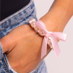 Adorable Pink Pearl Stretch Bracelet With Unique Pink Bow Ribbon Accent Elegant Spring Wristlet, Feminine Adjustable Bracelets For Party, Feminine Adjustable Party Bracelets, Adjustable Feminine Party Bracelets, Elegant Pink Wristlet For Spring, Elegant Pink Wristlet For Gift, Turquoise Silver Bracelet, Ribbon Bracelet, Ribbon Bracelets