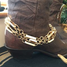 "This is a handmade large link 3 strand gold & ivory enamel metal boot bracelet. It is repurposed from a heavy metal belt. The links are bold & chunky & adds a classy touch to your boots. It measures 13\" + 3\" extension.  This item is sold as a single. This piece is designed with the bold woman in mind. Wear it to concerts, festivals, parties, weddings, or anytime when you need that extra glitz & glam. Made in the USA." Rocker Boots, Boot Bracelet, Boot Bling, Boot Jewelry, Metal Belt, Glitz And Glam, Anklet Jewelry, Body Jewellery, Bracelet Gold