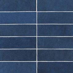 a blue tiled wall with white lines painted on the tiles in different colors and sizes