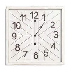 a white clock with black numbers on it