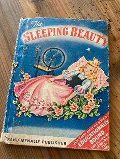 an old children's book with a sleeping beauty image on the front and back cover