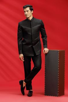 Top Details Color- Black, Fabric - Suiting Fabric With Embroidered Bottom Details Color- Black, Fabric - Suiting Fabric, Style - Pant Package Include :INCLUDES 1 TOP AND 1 PANT. Turban ,Mojari And Other Accessories Are Not Sold Along With The Dress. CARE: DRY CLEAN ONLY Additional Information : - As This Sherwani/Waistcoat/Kurta/Jodhpuri Are Made As Per Orders So It Is Strictly Not Acceptable Once Get Delivered .So Kindly Choose Body Fit Size . Also We Keep 2 Inches Extra Margin In The Dress. Traditional Black Blazer For Groom, Black Nehru Jacket For Ceremonial Festivals, Designer Black Nehru Jacket With Long Sleeves, Festive Black Blazer For Groom, Black Long Sleeve Bandhgala For Festivals, Black Winter Sherwani For Groom, Winter Black Sherwani For Groom, Black Winter Sherwani For Grooms, Traditional Black Nehru Jacket With Stand Collar