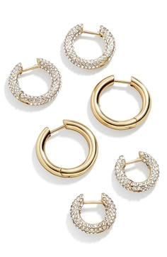 Enjoy three ways to sparkle and shine with this trio of huggie-hoop earrings in gleaming goldtone plating and rows of glistening crystals. Includes three pairs huggie hoop earrings 1/2"-3/8" hoop diameter; 1/8" width Hinges with snap-post closures Goldtone plate/glass/cubic zirconia Imported Preppy Jewelry, 18k Gold Earrings, Jewelry Accessories Ideas, Crystal Hoop Earrings, Dope Jewelry, Jewelry Lookbook, Earrings In Gold, Huggie Hoop Earrings, Jewelry Inspo