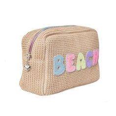 DESCRIPTION ﻿You’ll be feeling beachy keen bringing this stylish straw pouch to your day spent by the sea! Accented with bright bubble-letter patches that’ll sparkle ‘n shine in the sun, OMG’s ‘Beach’ pouch is the perfect place to stash your sunnies, SPF, and more! Rainbow Zipper Silver Heart Metal Puller Lined Measures Approx. - 6.00”H x 9.00”W x 3.00”D Trendy Beach Pouch Bag, Trendy Beach Cosmetic Pouch Bag, Trendy Beach Cosmetic Pouch, Trendy Vacation Cosmetic Pouch Bag, Beach Pouch, Straw Pouch, Letter Patches, Bubble Letter, Bubble Letters