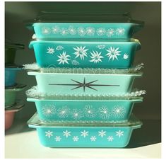 stacking dishes with flower designs on them are stacked in the shape of snowflakes