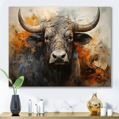 a painting of a bull with large horns on it's face, in front of a white wall