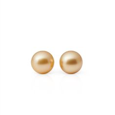 Simple statements of elegance, pearls have been a mainstay in Gump's fine jewelry assortment for decades. Revered for their alluring luster and classic beauty, they are widely recognized as symbols of purity, integrity and wisdom gained through experience. To create these earrings, each pearl is carefully selected for quality, color and shape. Golden South Sea cultured pearls, 9mm. 14-karat yellow gold. Pierced only. Formal Pearl Drop Earrings, Formal Round Bead Pearl Earrings With Matching Set, Classic Pearl Earrings For Anniversary, Classic Round Pearl Earrings For Anniversary, Elegant Pearl Drop Earrings With Round Beads, Refined Pearl Earrings For Formal Occasions, Timeless Pearl Earrings For Formal Occasions, Formal High Luster Akoya Pearl Earrings, Classic Akoya Pearl Earrings For Formal Occasions