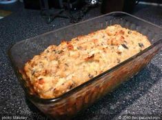 a casserole dish filled with food sitting on top of a counter