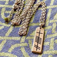 Wanting a very unique way to tell someone you love them? Gift the Ogham Grá Stone necklace that spells Love in the ancient Ogham language. Solid sterling silver with choice of normal or heavy chain 🍀 Spiritual Etched Rectangular Pendant Necklace, Antique Engraved Good Luck Necklace, Antique Engraved Necklace For Good Luck, Etched Rectangular Pendant Spiritual Necklace, Symbolic Bronze Etched Necklace, Symbolic Engraved Rectangular Pendant Necklaces, Symbolic Engraved Rectangular Pendant Necklace, Symbolic Etched Necklaces For Ceremonial Use, Symbolic Etched Necklaces For Ceremonial Occasions