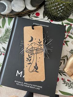 a bookmark with an image of a mushroom on it and other items surrounding it