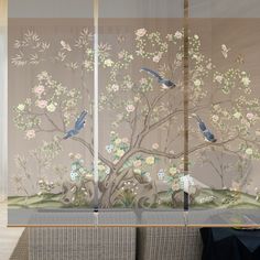 a room divider with flowers and birds on it