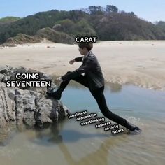 a man in a suit standing on top of a rock next to the ocean with caption that reads, carat going seventeen