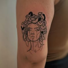 a woman's arm with a tattoo on it that has an image of a woman