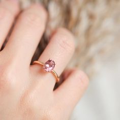 This solitaire ring features a stunning oval pink tourmaline, beautifully set on a delicate 14k gold band. Material: Solid 14-karat gold Gold Colors: Yellow, rose, or white gold Main Gemstone: Oval pink tourmaline, 8 x 6 mm Band Width: 1.75 mm A timeless and elegant piece that adds a touch of color to any occasion. Pink Gemstone Ring, Tourmaline Engagement Ring, Pink Tourmaline Ring, Solid Gold Band, Etsy Gold Ring, Gold Colors, Solid Gold Rings, Tourmaline Ring, Pink Gemstones