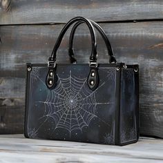 Cosmic Spider Web PU Leather Handbag Upgrade your style with this New Version Luxury Women PU Leather Handbag. Crafted from premium PU leather, this handbag features a smooth zipper and sturdy top handles for comfortable carrying. Available in three sizes, it offers versatility and convenience for any occasion. Perfect gift for girls, moms, and office ladies. Ideal for commuting and traveling, this handbag can accommodate your cell phone, wallet, and other daily essentials.  * Premium PU Leather Inside Purse Aesthetic, Pretty Bags, Spider Web, Hippie Style, Gifts For Girls, Travel Bags, Purses Crossbody, Leather Handbags, Pu Leather