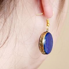 vintage lapis lazuli Kuchi earrings, Afghan jewelry, boho earrings, circle earrings,old blue earrings,gift for her,gift for mum,long earring measures approximately  4cm  Weight:9g Material:genuine lapis lazuli,  Nickle free gold plated metal. Beautiful round circle genuine lapis lazuli gold fram earrings. Minimalistically  designed with 18k gold plated. These earrings are inspired by the kuchi jewelry and they look amazing. Light to medium weight and great to wear all day. These earrings are great for everyday or any occasion. Makes a beautiful unique gift for: Valentines day  Mothers day  Anniversary  Birthday Traditional Round Lapis Lazuli Jewelry, Blue Round Brass Jewelry, Blue Brass Round Jewelry, Handmade Gold Lapis Lazuli Earrings, Handmade Gold Earrings With Lapis Lazuli, Gold Lapis Lazuli Earrings For Gift, Gold Lapis Lazuli Earrings As Gift, Brass Gemstone Round Earrings, Round Brass Earrings With Gemstone