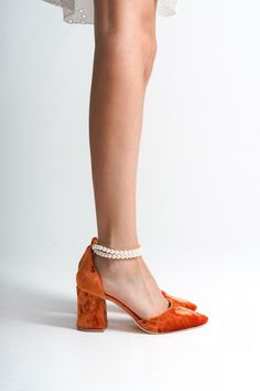 ORANGE VELVET SHOES, ORANGE WEDDING SHOES, ORANGE SHOES, ORANGE HIGH HEELS, ORANGE BLOCK HEELS, ORANGE BRIDAL SHOES, ORANGE HEELS As Eleanor Louise, we stand out with our Orange heeled shoes that combine style and comfort. Specifically designed for brides, these shoes are crafted with high-quality materials. * Made from Orange Velvet and Premium Vegan Leather, our shoes are equipped with an ankle strap that provides comfort throughout the day. * Completing your style and boosting your confidence is the most elegant way! Orange Velvet 3.15-inch (8 cm) high-heeled shoes offer elegance and chicness with every step. Whether it's for daily wear or a special event, these shoes not only add height but also provide a sophisticated touch to your style. * Their classic and elegant design perfectly c Orange Velvet Shoes, Orange Closed Toe Elegant Heels, Elegant Orange Heels With Wrapped Heel, Elegant Orange Closed Toe Heels, Elegant Orange Ankle Strap Heels, Orange Almond Toe Heels For Party, Party Orange Almond Toe Heels, Orange Low Heel Party Heels, Elegant Orange Block Heel Shoes