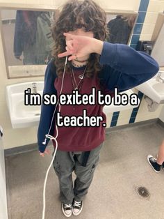 a girl in a bathroom pointing at her ear with the caption i'm so excited to be a teacher