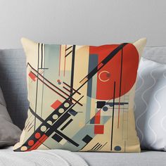 a throw pillow with an abstract design on it