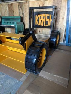 some yellow and black construction equipment in a room