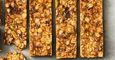 granola bars are lined up on a baking sheet and ready to be cut into pieces