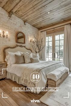 a bedroom with french country bedspreads and pillows on the bed in front of a large window