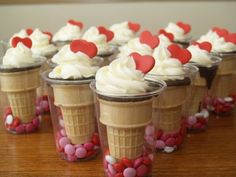 cupcakes in cups with hearts on them