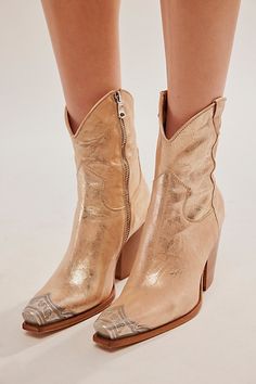 Gorgeous Italian-crafted leather boots featured in a western-inspired style with an etched metal toe, slim sit and stacked heel. * Side zipper closure * Cushioned insole * Curved top **Fit Note:** This style runs small. If between sizes, we suggest sizing up. | Brayden Western Boots by FP Collection at Free People in Gold, Size: EU 38 Bridesmaids In Cowboy Boots, Cocktail Dress With Cowgirl Boots, Western Gold Boots With Pointed Toe, Western Gold Boots For Rodeo, Western Gold Heeled Boots, Gold Western Boots With Almond Toe, Western Style Gold Heeled Boots, Gold Snip Toe Boots For Rodeo, Cowgirl Booties Outfits