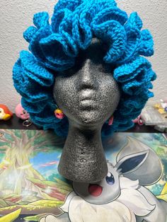 there is a wig on top of a mannequin's head with blue hair