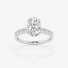 a diamond engagement ring on a white background