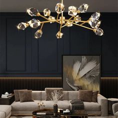 a living room with couches, chairs and a chandelier in the middle