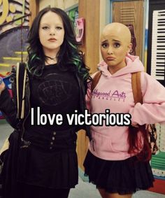 two women standing next to each other with the caption i love victorious