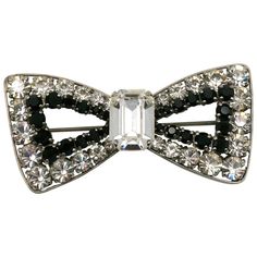 YVES SAINT LAURENT vintage bow brooch embellished with black and clear crystals. Silver tone metal hardware. Embossed YSL. Indicative measurements : max. height approx. 3.6 cm (1.42 inches) / max. width approx. 7.2 cm (2.83 inches). NOTES - This is a preloved vintage item, therefore it might have imperfections. - Colors may differ slightly from actual product appearance due to differences in lighting conditions. - As a buyer, you are fully responsible for customs duties, other local taxes and an Ysl Vintage, Saint Laurent Vintage, Bow Brooch, Fashion Hair Accessories, Clear Crystals, Vintage Jewels, Stylish Fashion, Metal Hardware, Hair Claw