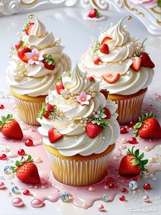 three cupcakes with white frosting and strawberries