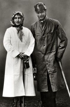 an old black and white photo of two people