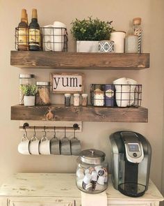 a coffee maker and some shelves with items on them in a small room or kitchen