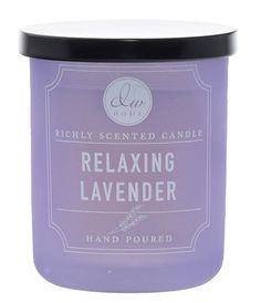 a candle that is sitting on a white surface with the words relaxing lavender in it