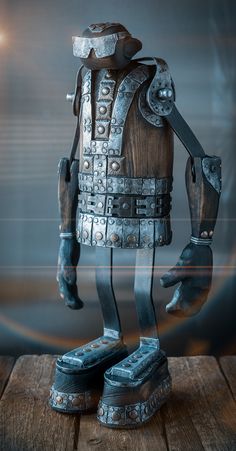 a statue of a man in armor standing on top of a wooden table