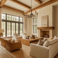 a living room filled with furniture and a fire place in front of a large window