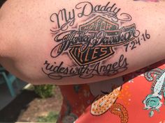 a person with a tattoo on their arm that says my daddy is harley davidson rides north america