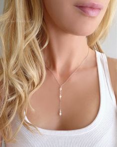 With a dainty and feminine flair, this necklace exudes a subtle sparkle and modern minimalist style ~ Available in 14k gold fill, rose gold fill or sterling silver These genuine freshwater pearls have a gorgeous luster and are nearly flawless! Sparkling crystals are genuine Swarovski Chain can be made in 14k gold filled, sterling silver or rose gold filled Necklace closes with a spring clasp Necklace is shown at 17" length - The length measurement does not include the dangle section The pearl da Rose Gold Choker Necklace, Droplet Necklace, Necklace For Wedding, Rose Gold Choker, Pearl Lariat, Pearl Drop Necklace, Choker Pendant, Length Measurement, Chula Vista