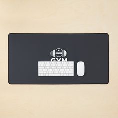 a mouse pad with a keyboard and headphones on it