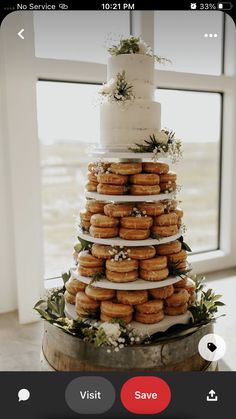 a wedding cake with donuts stacked on top