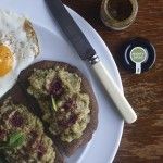 a plate with eggs, bread and other food on it