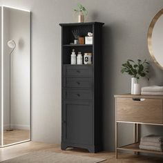 a bathroom with a cabinet and mirror in it