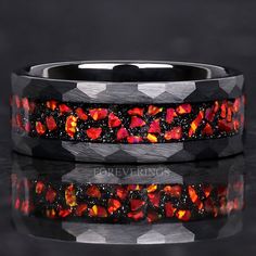 Introducing our Red Nebula Opal Ring for Men. This 8mm black tungsten band features a striking crushed red fire opal inlay, a rugged brushed and hammered finish, and a comfortable flat profile. Ideal for weddings, anniversaries, or special occasions, it makes a bold and stylish statement. ►Material: Tungsten Carbide and Crushed Opal Inlay ►Color: Red Nebula Inspired ►Comfort Fit ►Band width: 8mm ►Fit is true to size. ►Your crushed opal inlay is protected with a coating that defends it from water, dirt, and grime.  ✓ 100% Cobalt-Free ✓ Hypoallergenic ✓ Comfort Fit ✓ Free Ring Box ✓ Free Shipping within the US ✓ Ready to ship next business day Custom Engraving Add-On Link Below. Engraved rings are final sale. https://www.etsy.com/listing/1344222867 ►Your tungsten ring will not turn green its Opal Ring Men, Red Wedding Band, Opal Ring For Men, Red Nebula, Ring Men Wedding, Red Engagement Ring, Rp Outfits, Men Wedding Band, Red Opal